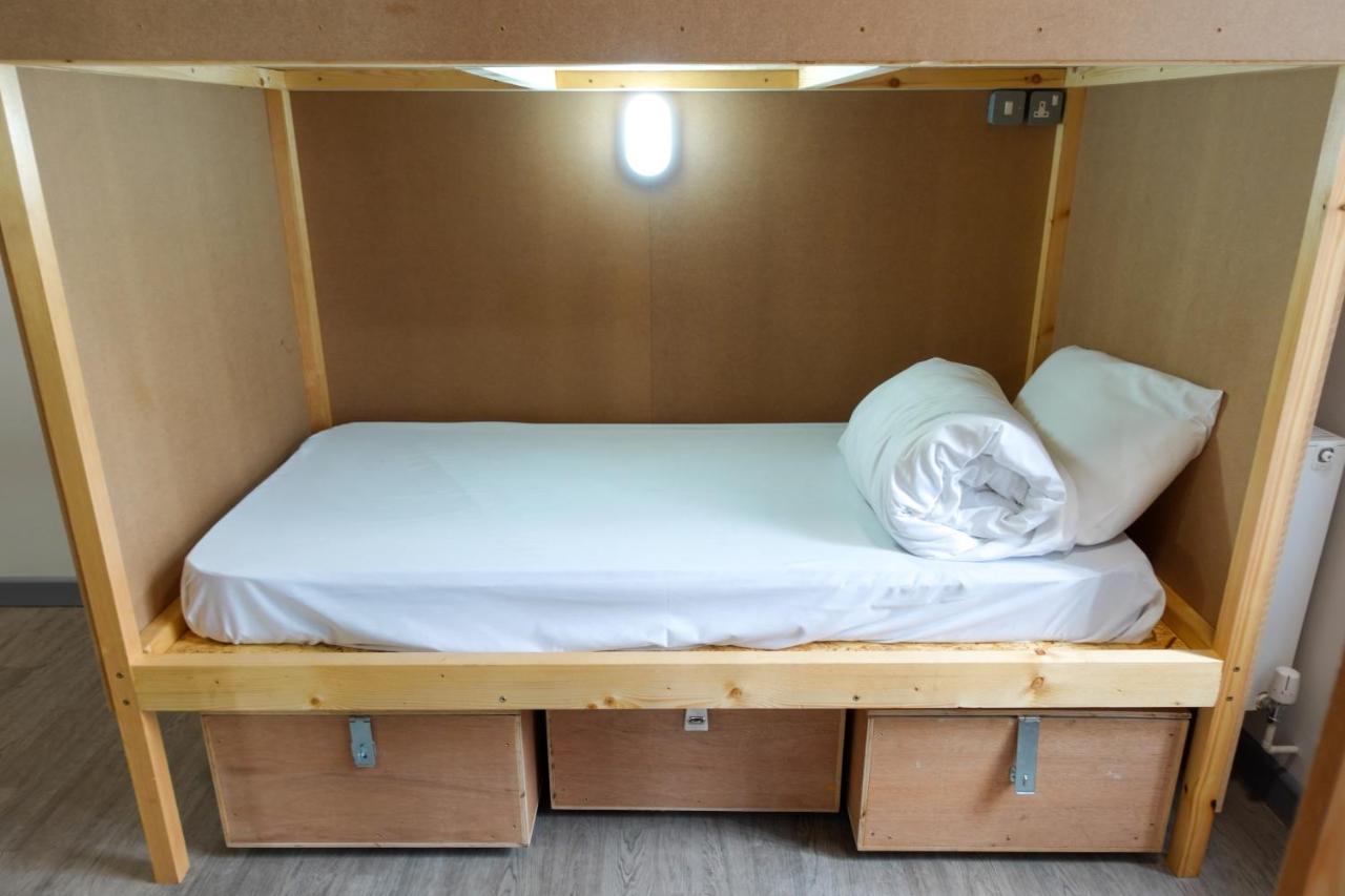 Cwtsh Hostel Swansea Exterior photo A bunk bed with storage boxes